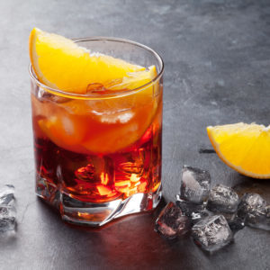 Negroni cocktail on dark stone table
